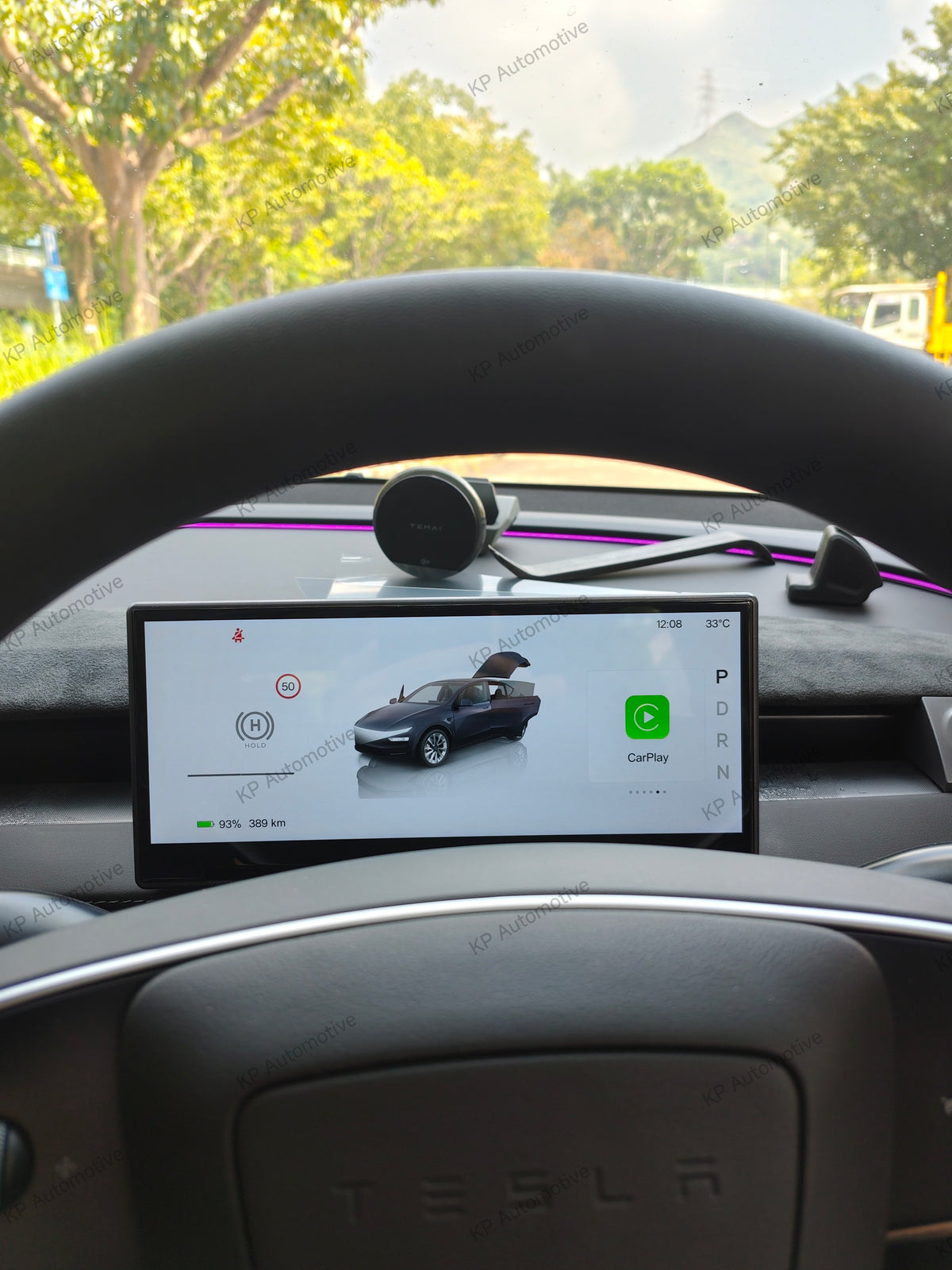 Car dashboard display with airflow vent, wide screen showing parking and driving view